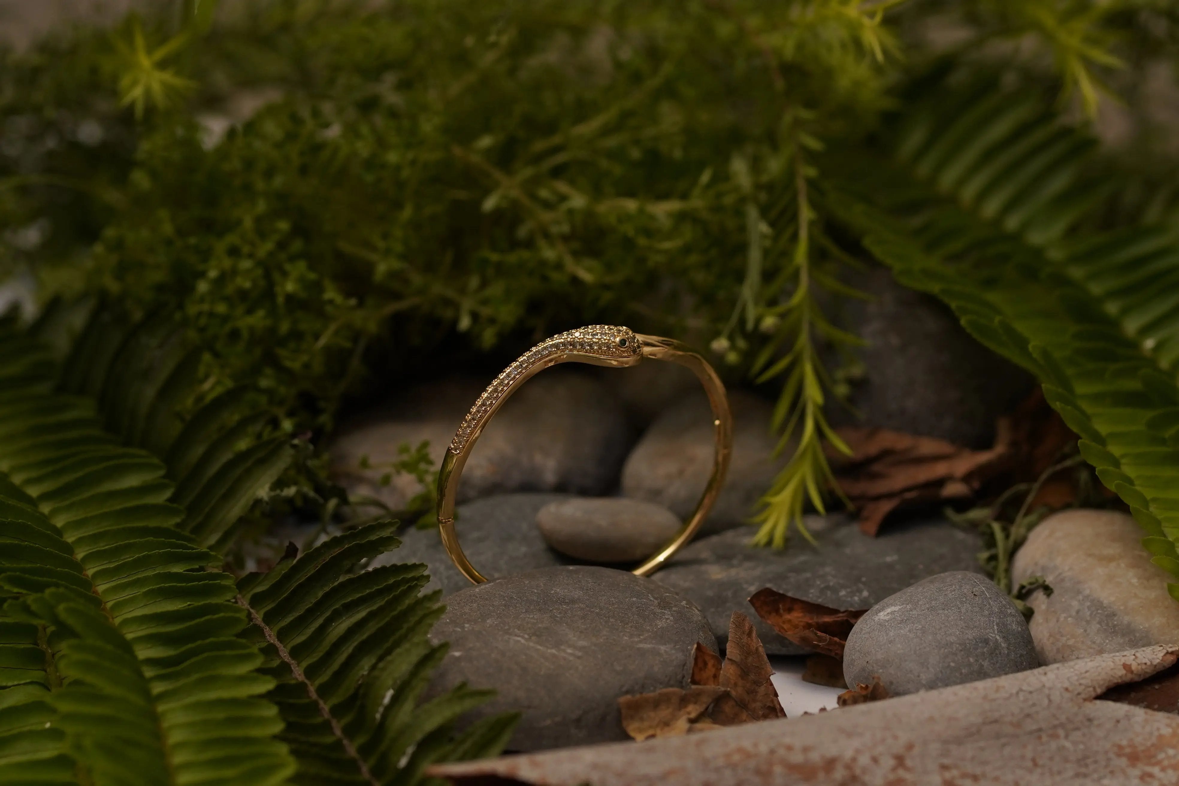 Elegant Gold Snake Design Bracelet with Sparkling Stone Accents SIZZLE JEWELS