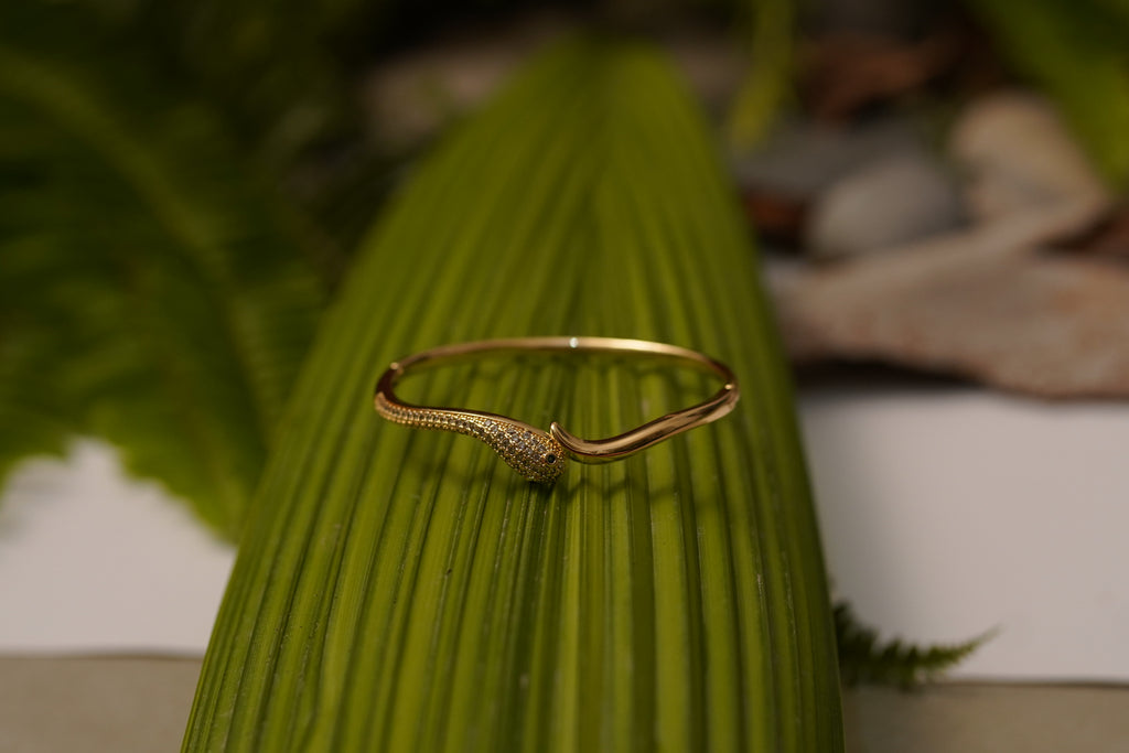Elegant Gold Snake Design Bracelet with Sparkling Stone Accents